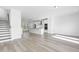 Bright and airy living space features wood floors and is near the kitchen at 1215 Corkery Ridge Ct, Cary, NC 27519
