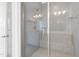 Modern bathroom featuring a glass enclosed shower with gray tile surround and built-in bench at 1215 Corkery Ridge Ct, Cary, NC 27519