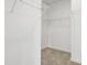Spacious walk-in closet featuring built in wire shelving, adjacent to the bedroom at 1215 Corkery Ridge Ct, Cary, NC 27519