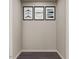 Laundry room area with neutral walls and modern artwork creating a clean and functional space at 123 Landon Pl, Roxboro, NC 27573
