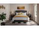 Cozy primary bedroom with a tufted headboard, soft lighting, and elegant decor elements at 123 Landon Pl, Roxboro, NC 27573