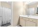 Bathroom featuring a single sink vanity with shower featuring a white shower curtain at 12308 Bunchgrass Ln, Raleigh, NC 27614
