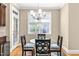Cozy breakfast nook by a bright window and access to the back patio at 12308 Bunchgrass Ln, Raleigh, NC 27614