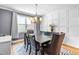 Traditional dining room with decorative molding, chandelier, and zebra patterned rug at 12308 Bunchgrass Ln, Raleigh, NC 27614