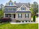 Charming two-story brick home with manicured lawn and mature trees at 12308 Bunchgrass Ln, Raleigh, NC 27614