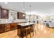 Modern kitchen with stainless steel appliances, granite countertops, and an island at 12308 Bunchgrass Ln, Raleigh, NC 27614
