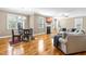 Bright living room with hardwood floors, a fireplace, and comfortable seating area at 12308 Bunchgrass Ln, Raleigh, NC 27614