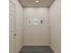Well-lit hallway, featuring modern interior design with decor and luxury vinyl plank flooring at 129 Lillian Ct, Roxboro, NC 27573