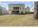 Private backyard with a screened porch and seating area, perfect for outdoor relaxation at 1305 Reservoir View Ln, Wake Forest, NC 27587