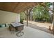 Backyard patio with outdoor dining table and view of wooded area at 1305 Reservoir View Ln, Wake Forest, NC 27587