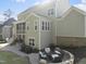 Backyard with an outdoor seating area, a stone fire pit, and professional landscaping at 1305 Reservoir View Ln, Wake Forest, NC 27587