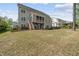 Large backyard featuring a two-story home with a screened-in porch at 1305 Reservoir View Ln, Wake Forest, NC 27587