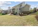 The backyard features a well-maintained lawn and inviting stone fire pit at 1305 Reservoir View Ln, Wake Forest, NC 27587