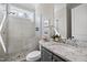 Bright bathroom with tiled shower, granite countertop, modern fixtures, and neutral color palette at 1305 Reservoir View Ln, Wake Forest, NC 27587