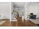 Elegant foyer with hardwood floors, staircase, and view into the living spaces at 1305 Reservoir View Ln, Wake Forest, NC 27587