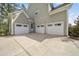 Large three-car garage providing plenty of parking and storage space at 1305 Reservoir View Ln, Wake Forest, NC 27587