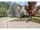 Spacious three-car garage with ample parking and attractive landscaping at 1305 Reservoir View Ln, Wake Forest, NC 27587