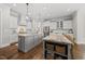 Well-appointed kitchen with granite countertops, stainless steel appliances, and a large island with seating at 1305 Reservoir View Ln, Wake Forest, NC 27587