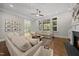 Comfortable living room offering hardwood floors, neutral furnishings, and access to an outdoor space at 1305 Reservoir View Ln, Wake Forest, NC 27587