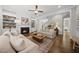 Comfortable living room with a fireplace, built-in shelving, and a cozy seating area at 1305 Reservoir View Ln, Wake Forest, NC 27587