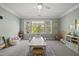 This spacious playroom is well-lit with large windows at 1305 Reservoir View Ln, Wake Forest, NC 27587