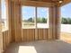 View of the wooden framing for a covered porch with backyard views at 139 Fast Pitch Ln, Four Oaks, NC 27524