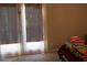 Bedroom features natural light from glass patio doors and neutral carpeting, perfect for relaxation at 1505 Kendall Dr, Durham, NC 27703