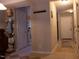 Hallway view featuring tile flooring, neutral walls, and doors leading to other rooms at 1505 Kendall Dr, Durham, NC 27703