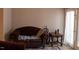 A living room with a dark brown sofa, a patterned rug, and a small side table at 1505 Kendall Dr, Durham, NC 27703