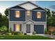 Two-story home featuring blue siding, gray accents, a covered entry, an attached garage, and a well-manicured lawn at 158 Lillian Ct, Roxboro, NC 27573