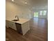 Open-concept kitchen with an island that offers a lot of counter space and stainless appliances at 168 Parker Ln, Mebane, NC 27302