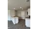 Kitchen featuring a breakfast bar, white cabinets, granite countertops, and stainless steel appliances at 173 Lillian Ct, Roxboro, NC 27573