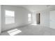 Carpeted bedroom offering natural light through its two windows and featuring white walls at 176 Lillian Ct, Roxboro, NC 27573