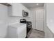 Kitchen featuring stainless steel appliances and white cabinetry with modern countertops at 176 Lillian Ct, Roxboro, NC 27573
