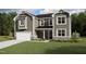 Charming two-story home with a covered porch, attached garage, and well-maintained landscaping at 1809 Harrell Cove Ct Ct # 181 Gunnison Fc, Fuquay Varina, NC 27526