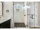 Modern bathroom with a glass-enclosed shower, updated fixtures, and a sleek vanity at 203 Sourgum Ct, Zebulon, NC 27597
