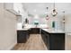 Bright kitchen featuring a stylish island, modern appliances, and hardwood floors at 203 Sourgum Ct, Zebulon, NC 27597