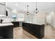 Modern kitchen with an island, stainless steel appliances, and plenty of counter space at 203 Sourgum Ct, Zebulon, NC 27597