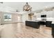 Open-concept kitchen island with sleek countertops and pendant lighting at 203 Sourgum Ct, Zebulon, NC 27597