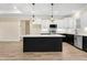 Chic kitchen featuring an island, stainless steel appliances, and white cabinets at 203 Sourgum Ct, Zebulon, NC 27597