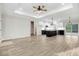 Open living and kitchen space is filled with natural light, seamlessly connected at 203 Sourgum Ct, Zebulon, NC 27597