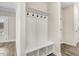 Functional mudroom includes bench seating, coat hooks, and built-in storage solutions at 203 Sourgum Ct, Zebulon, NC 27597