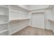 A spacious walk-in closet with ample shelving and storage space is shown; perfect for organization at 203 Sourgum Ct, Zebulon, NC 27597