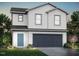 Charming two-story home featuring a blue front door and a two-car garage at 209 Lillian Ct, Roxboro, NC 27573