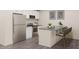 Modern kitchen featuring stainless steel appliances, an island, and stylish countertops at 213 Landon Pl, Roxboro, NC 27573