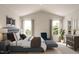 Comfortable main bedroom with vaulted ceiling, neutral color palette, and bright natural light at 213 Landon Pl, Roxboro, NC 27573