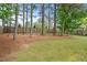 A spacious backyard with lush greenery and mature trees at 218 Darecrest Ln, Wendell, NC 27591