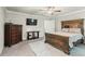 Well-furnished bedroom with decorative wood bed frame, accent lighting and large dresser at 218 Darecrest Ln, Wendell, NC 27591