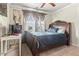 Bedroom featuring dark wood bed, modern decor, and a large window at 218 Darecrest Ln, Wendell, NC 27591