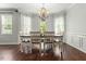 Formal dining room with a chandelier and plenty of natural light at 218 Darecrest Ln, Wendell, NC 27591